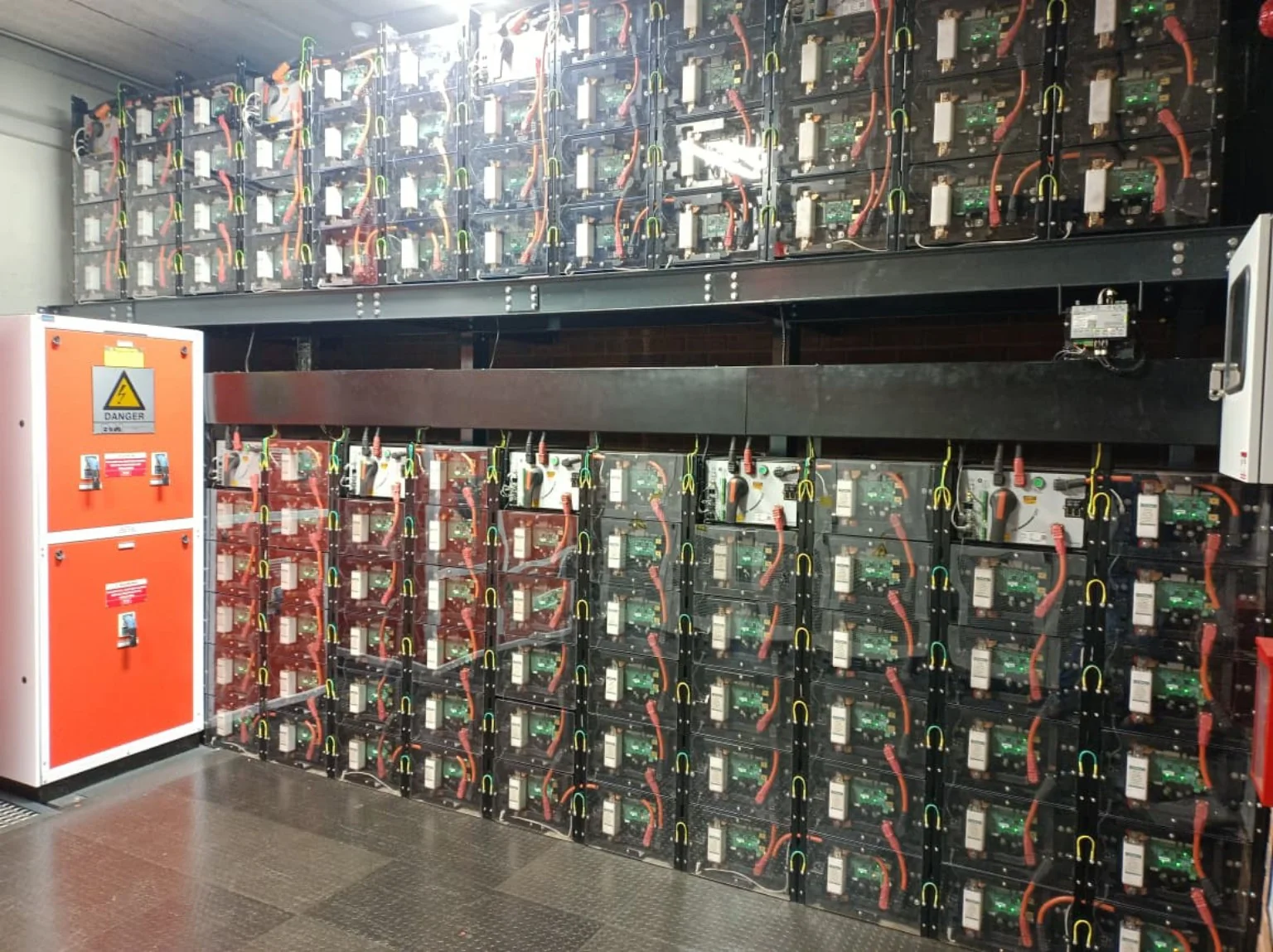 Actual large scale battery energy storage equipment and electrical distribution cabinets installed indoors